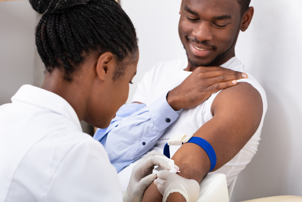 A Rofchem health professional caring for a patient